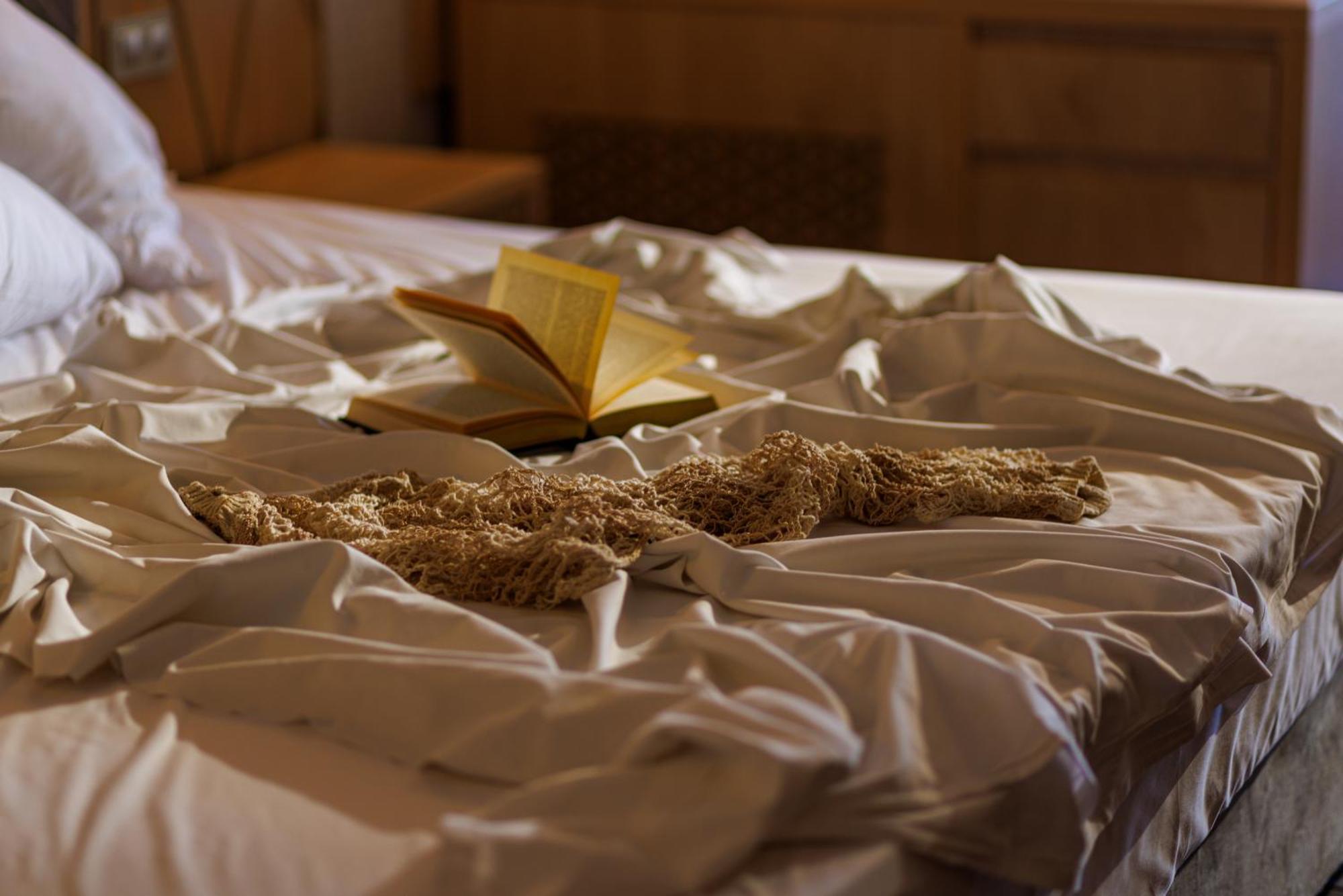Secrets Sunny Beach Resort & Spa (Adults Only) Экстерьер фото A bed with a book and a cat